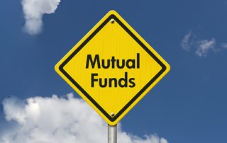 yellow caution sign with words mutual funds
