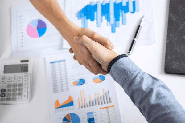 business handshake to seal deal on merger acquisition | Transaction Costs - Maximize Your Tax Benefits | Dalby Wendland & Co. | CPAs and Business Advisors | Grand Junction CO | Glenwood Springs CO | Montrose CO 